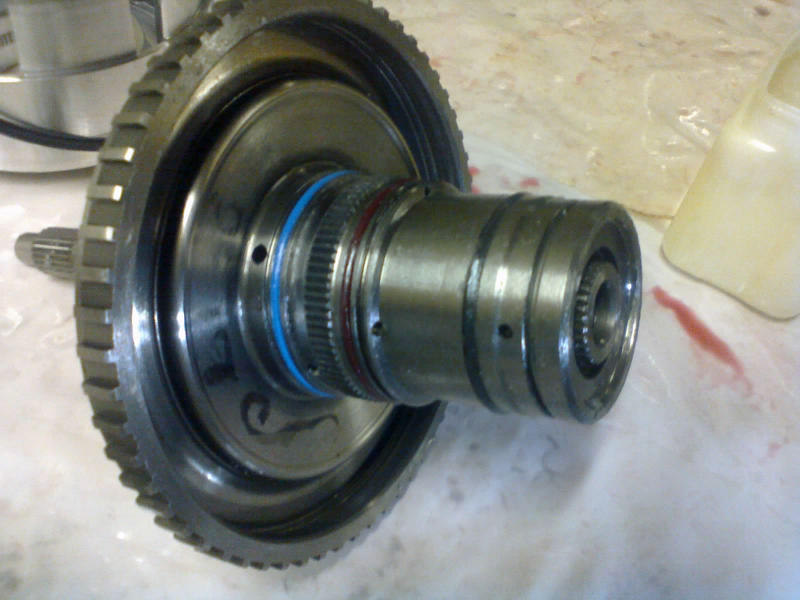 Some new o-rings and lip seals go onto the hub. (NOT PICTURED: the large lip seal that goes on the inside of that ring gear. Erm, actually, that’s not a ring gear. It’s the tone ring for the input speed sensor.)